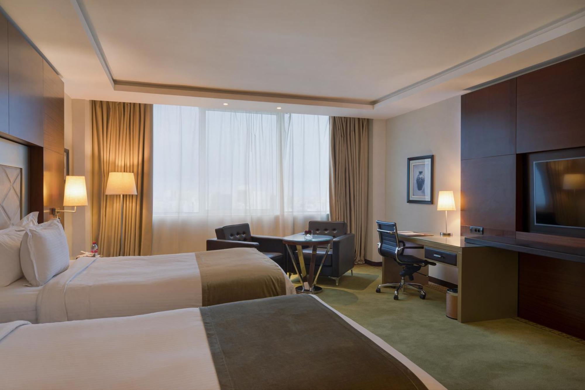 Grand Mogador City Center Casablanca Kültér fotó A room at the hotel